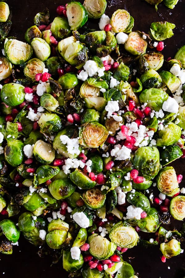These super simple roasted Brussels sprouts with pomegranate seeds and goat cheese are the perfect dish for your Thanksgiving table. Easy to throw together and packed full of flavor! 