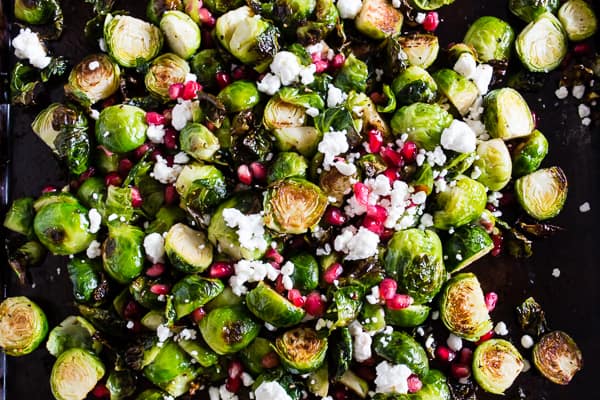These super simple roasted Brussels sprouts with pomegranate seeds and goat cheese are the perfect dish for your Thanksgiving table. Easy to throw together and packed full of flavor! 