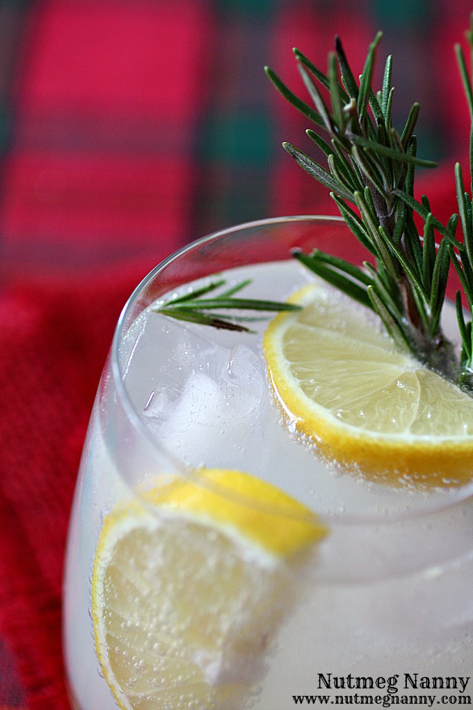 This rosemary lemon gin and tonic is the perfect holiday drink. Made with homemade honey rosemary syrup, fresh lemons, gin and tasty tonic. You'll love this!