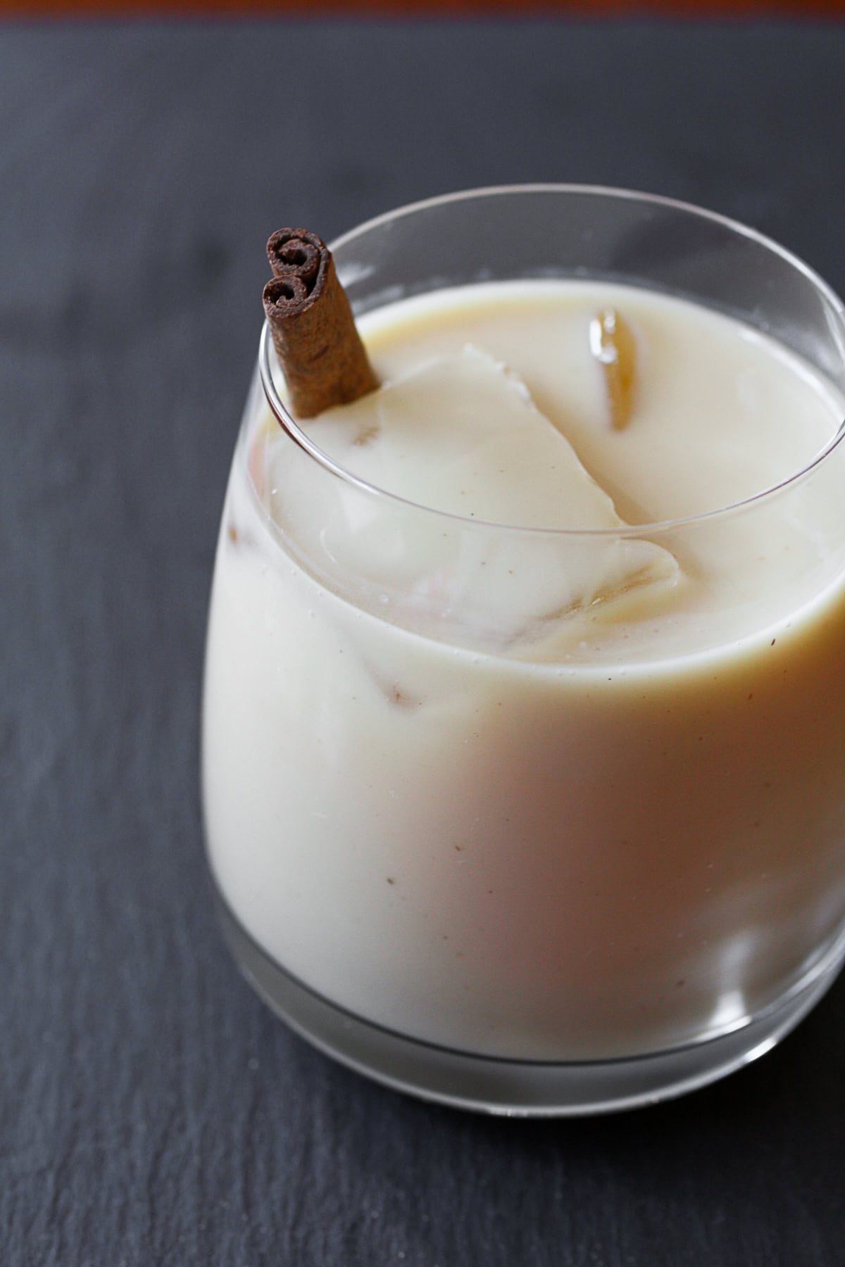 Coquito by Nutmeg Nanny {The Twelve Boozy Days of Christmas} Coquito Recipe in a glass.