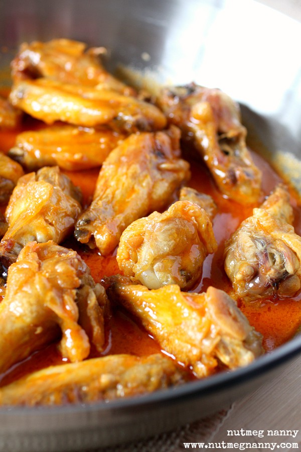 Baked Garlic Buffalo Wings in a pan. 