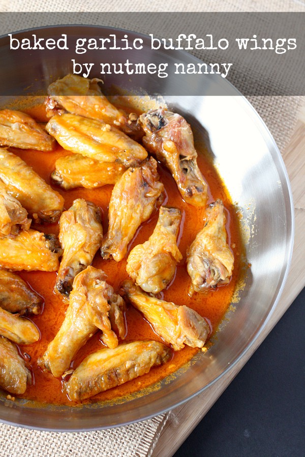 Baked Garlic Buffalo Wings tosses in sauce. 