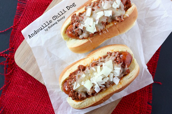 Andouille Chili Dog by Nutmeg Nanny These spicy andouille chili dogs are topped with a homemade chili meat sauce, cheese and just a sprinkling of onions. Spicy and delicious!