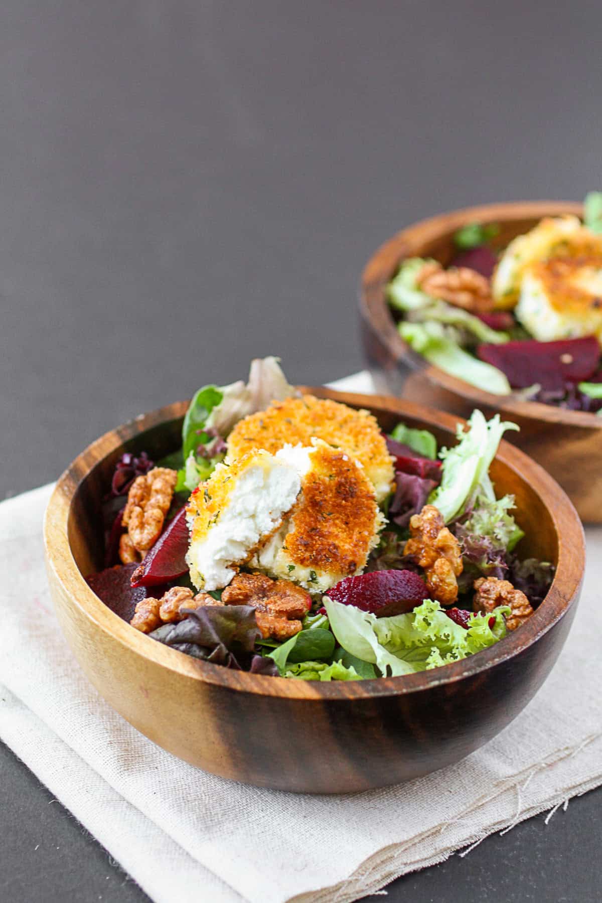 Fried Goat Cheese Salad in a wooden bowl. 
