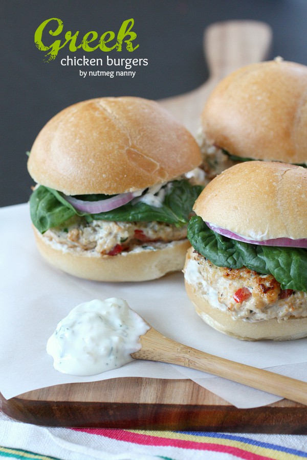 These Greek chicken burgers are slathered with Greek yogurt sauce and and homemade quick pickled red onions. This sandwich is packed full of flavor!