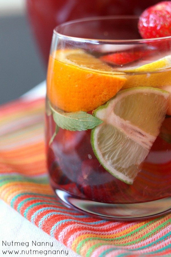Sparkling Summer Sangria by Nutmeg Nanny Sparkling Summer Sangria in a glass.