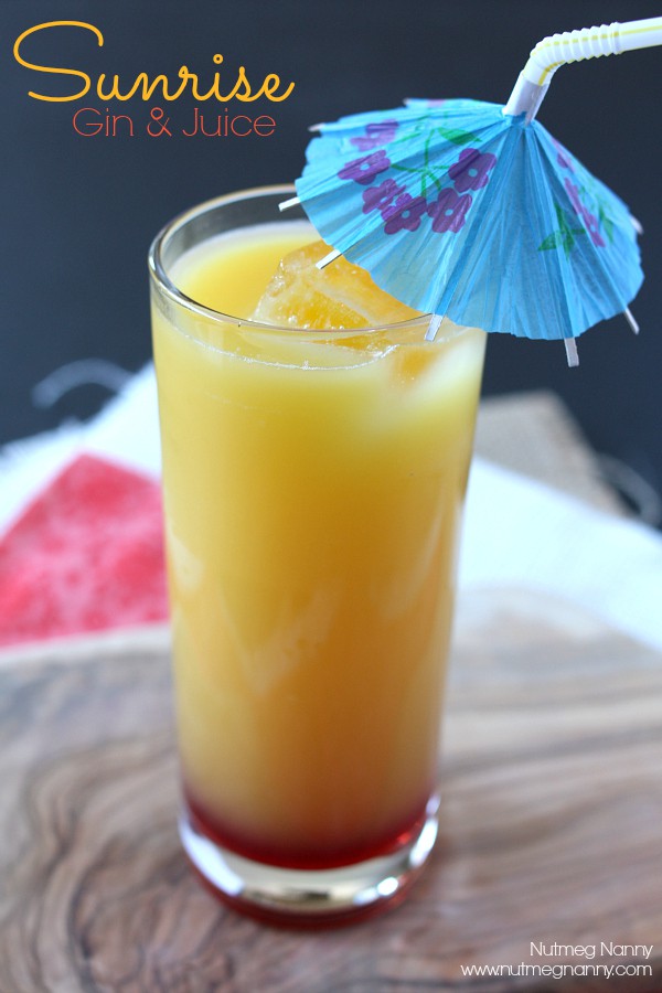 Gin and Juice Cocktail in a glass with an umbrella. 
