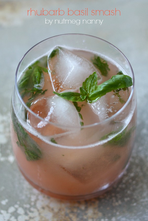 This rhubarb basil smash is the perfect summer cocktail. Delicious homemade rhubarb syrup combined with fresh basil, vodka, and bitters. You'll love this drink! 