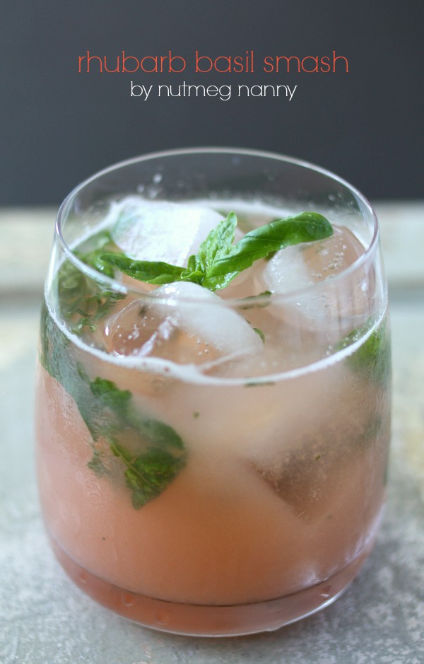This rhubarb basil smash is the perfect summer cocktail. Delicious homemade rhubarb syrup combined with fresh basil, vodka, and bitters. You'll love this drink! 