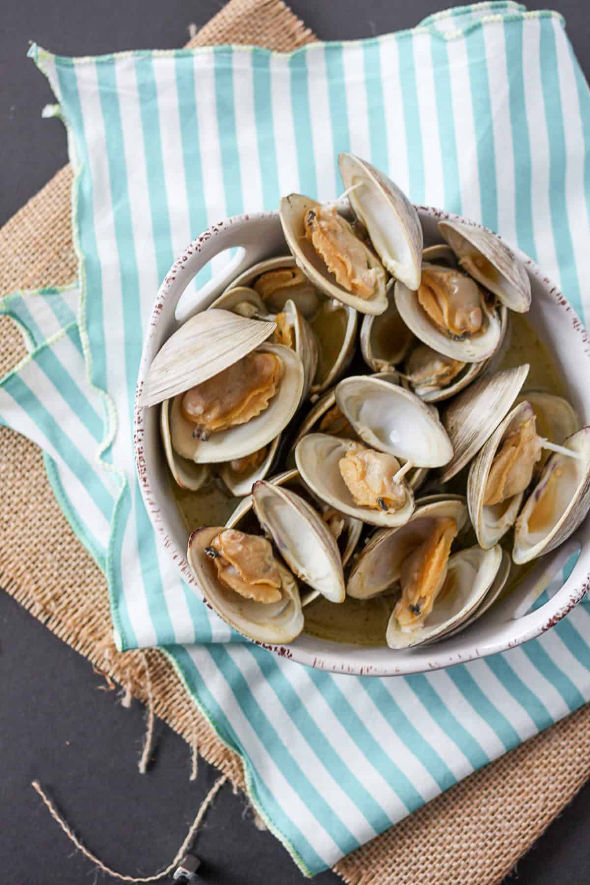 Beer Steamed Clams on a table in a bowl. 