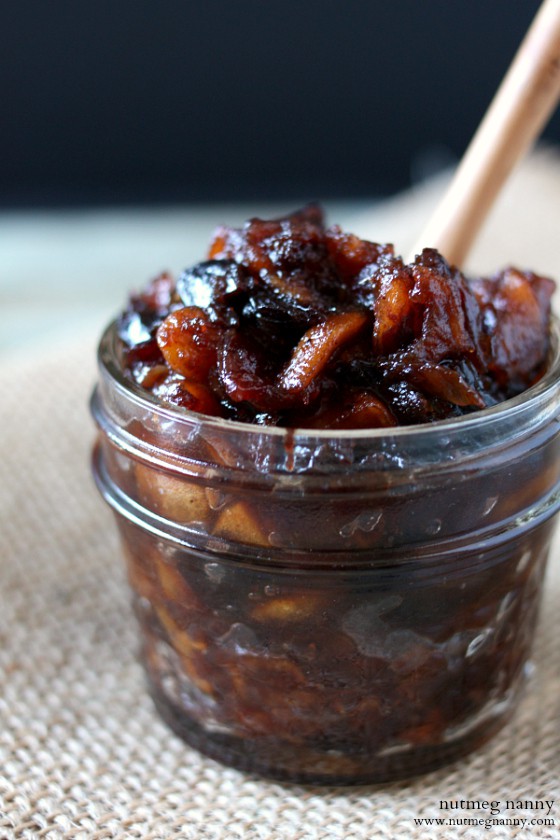 Spiced Apple Chutney by Nutmeg Nanny Spiced Apple Chutney in a bowl with a spoon.