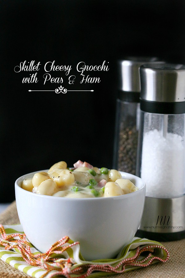 Skillet Cheesy Gnocchi with Peas and Ham by Nutmeg Nanny Skillet Cheesy Gnocchi with Peas and Ham in a white bowl.
