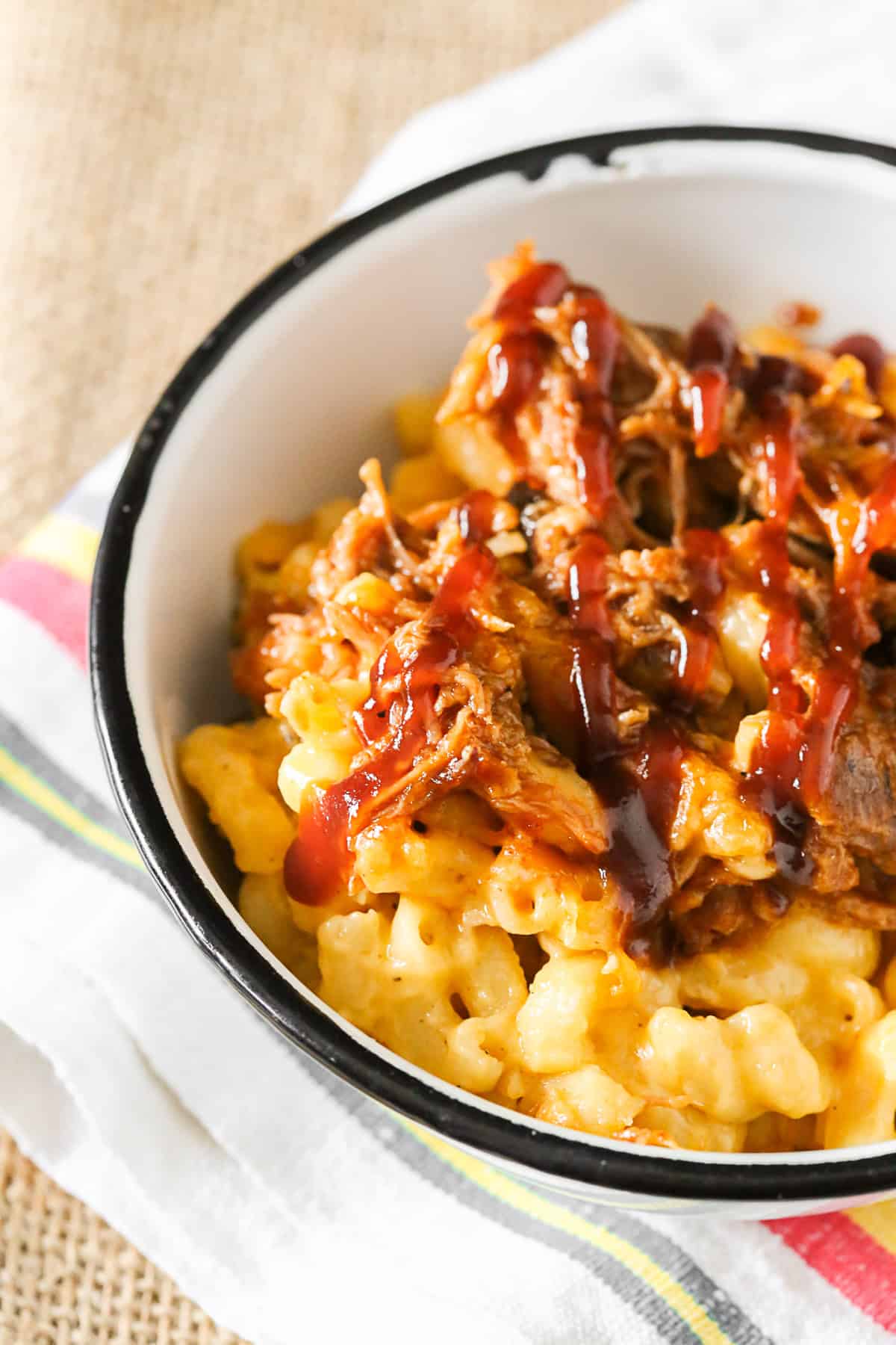 pulled pork mac and cheese scooped into a bowl