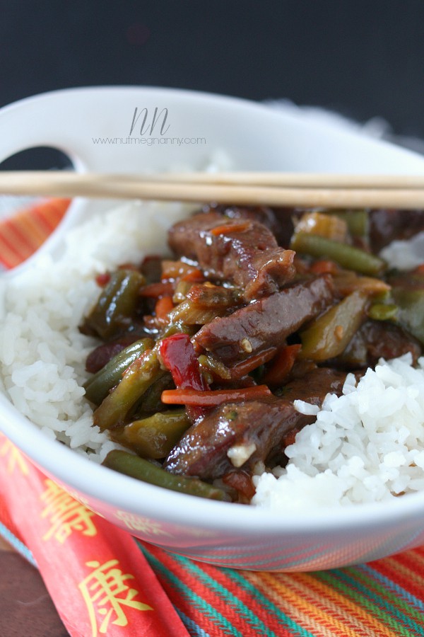 Beef and Vegetable Stir-Fry in a bowl over white rice. 