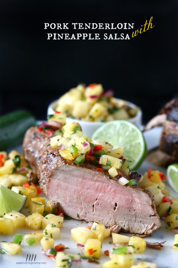 Pork Tenderloin with Pineapple Salsa on a cutting board. 