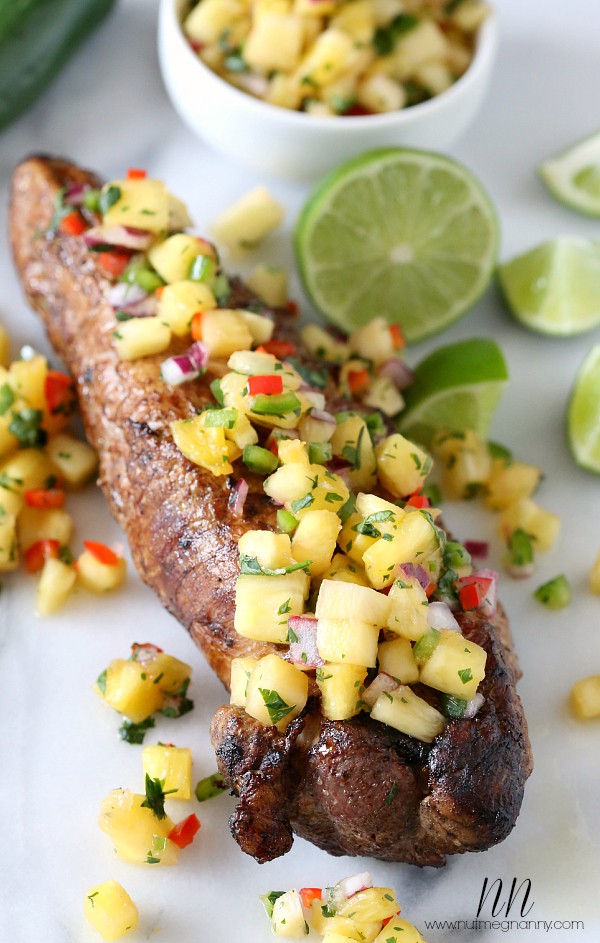 Pork Tenderloin with Pineapple Salsa served on a platter. 