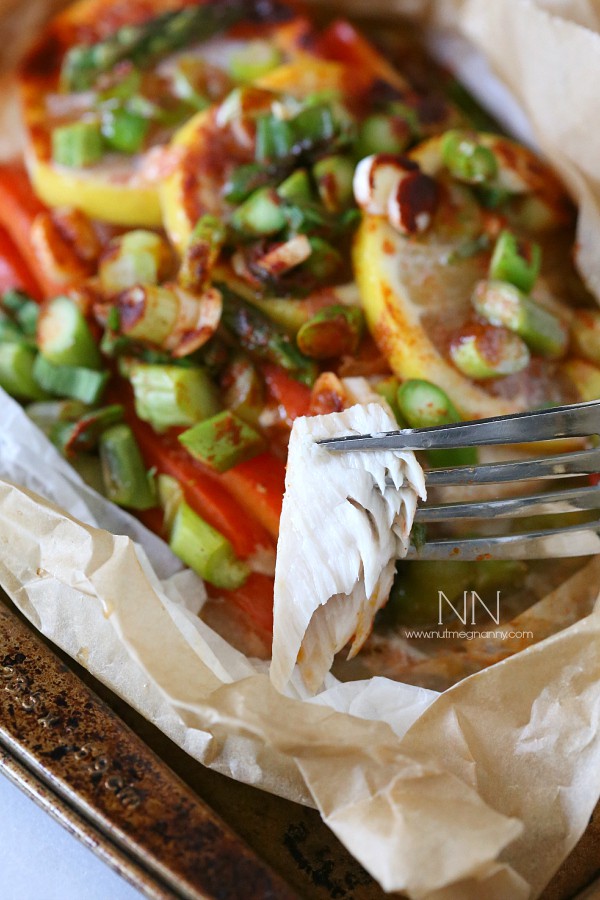 Mahi Mahi En Papillote with a piece of fish on a fork. 