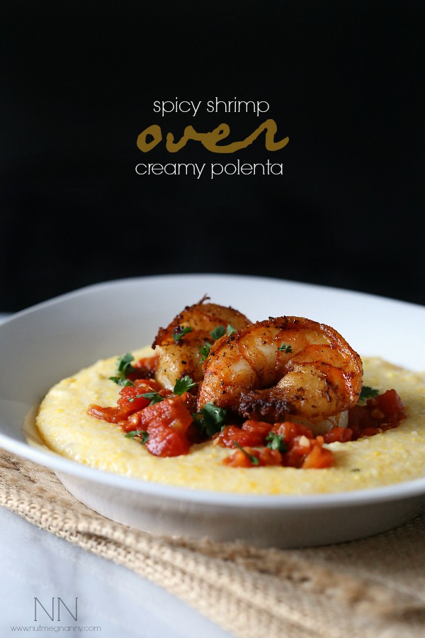 Spicy Shrimp Over Creamy Polenta in a bowl with a napkin under the bowl. 