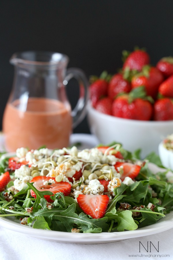 Strawberry Goat Cheese Quinoa Salad on a white plate with goat cheese.