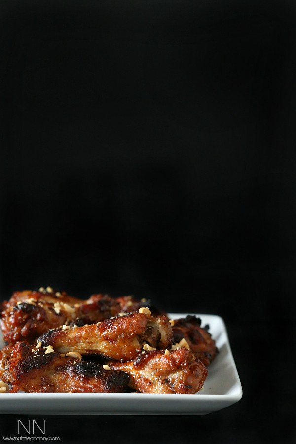 peanut butter and jelly chicken wings on a white plate