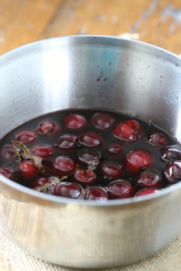 Pickled cherries cooking in a pot.