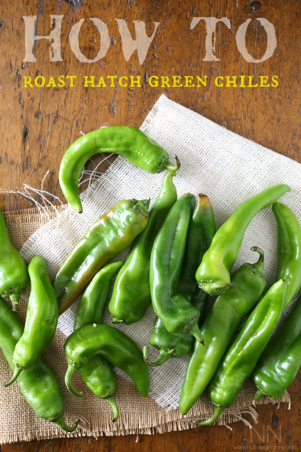 fresh hatch green chiles on a table.