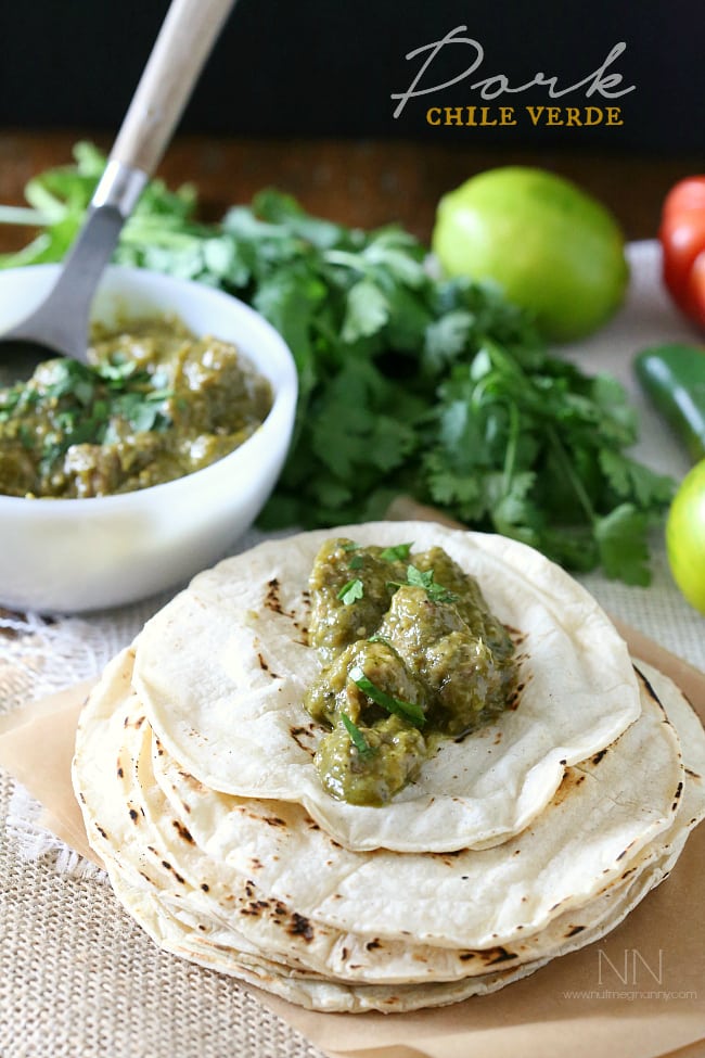 Pork Chile Verde spooned onto a tortilla. 