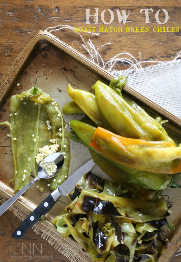 peeled roasted hatch green chiles on a baking sheet.