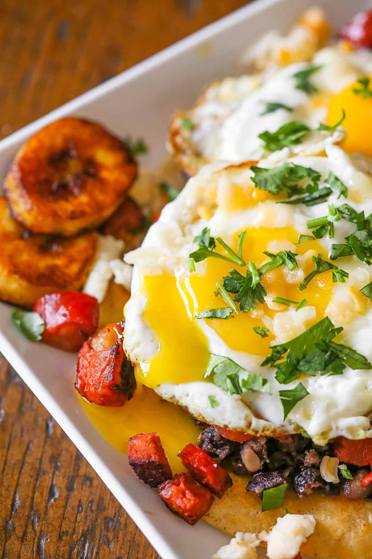 Huevos Motuleños served with plantians. 