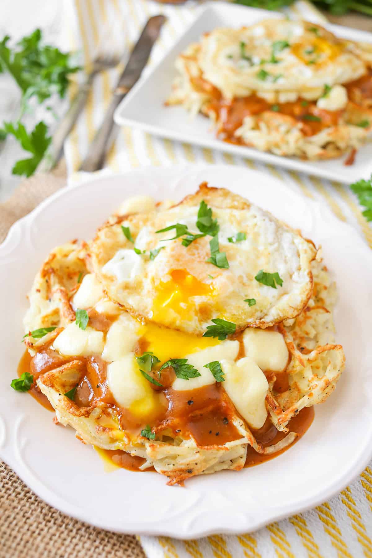 Poutine Hash Brown Waffles topped with an egg. 