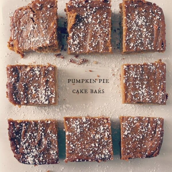 These pumpkin pie cake bars are like two desserts in one. Cake like bottom topped with a moist pumpkin pie top sprinkled with powdered sugar. Perfect for Thanksgiving!