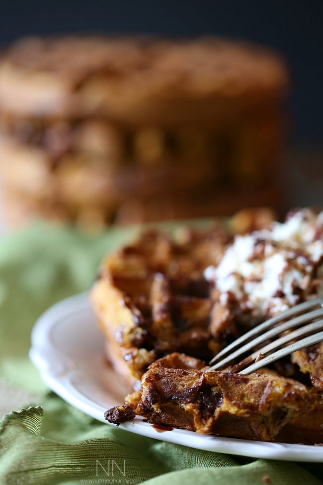 A fork picking up a bite of Pumpkin Waffle. 