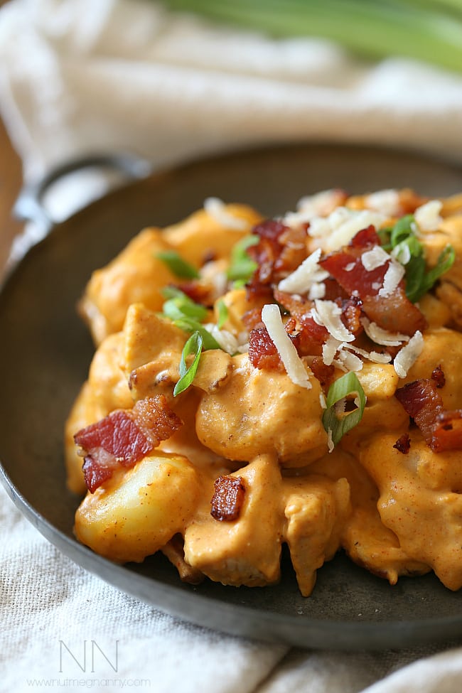 Chicken Bacon Pumpkin Gnocchi on a small plate. 