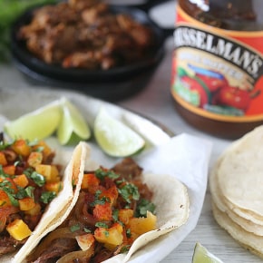 These chipotle apple butter carnitas are topped with apple cider sautéed onions and spiced butternut squash. This is one pork dish you will be craving!