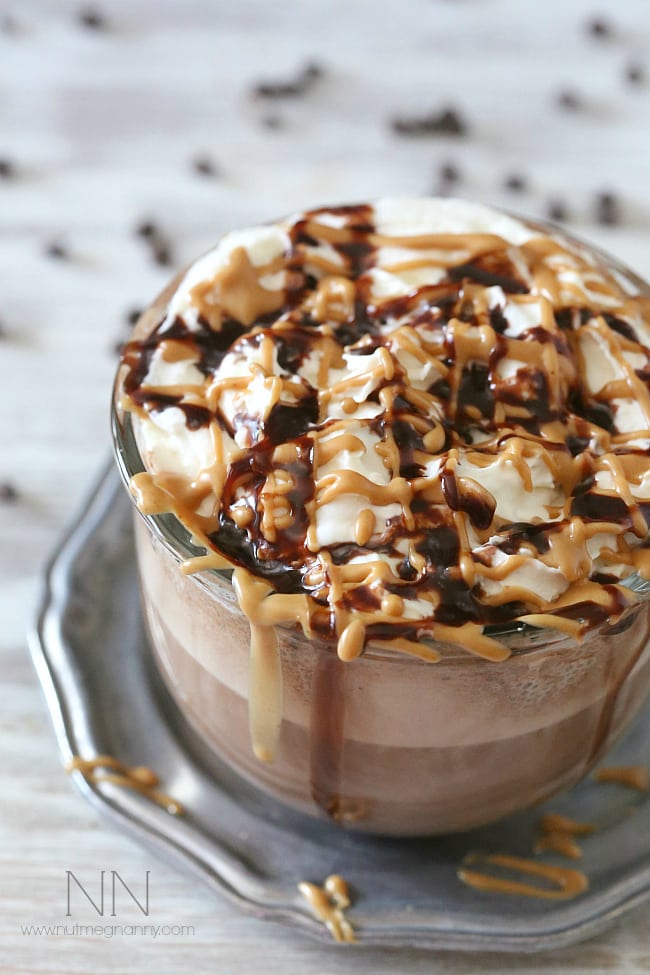 This rich and creamy peanut butter hot chocolate is perfect for keeping you warm all winter long. Plus it's super simply because it's made in your blender! That's right. I made this delicious treat right in my Vitamix! Peanut Butter Hot Chocolate in a large glass mug.