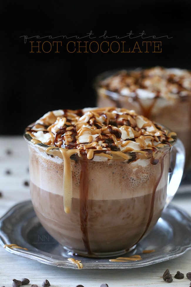 This rich and creamy peanut butter hot chocolate is perfect for keeping you warm all winter long. Plus it's super simply because it's made in your blender! That's right. I made this delicious treat right in my Vitamix! Peanut Butter Hot Chocolate in a glass mug.