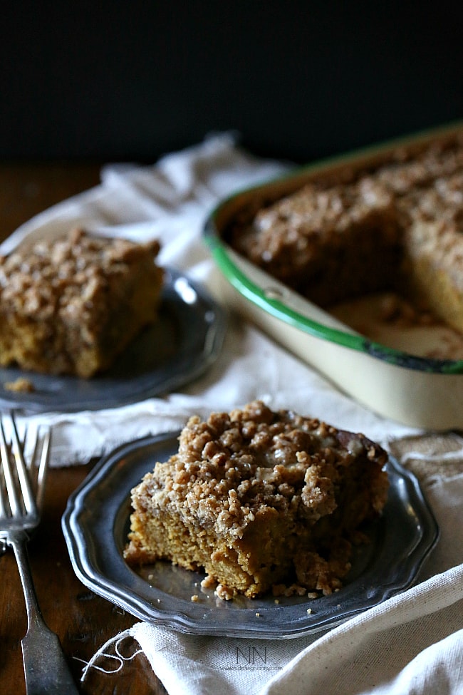 Pumpkin Spice Latte Coffee Cake sliced on a small metal plate. 