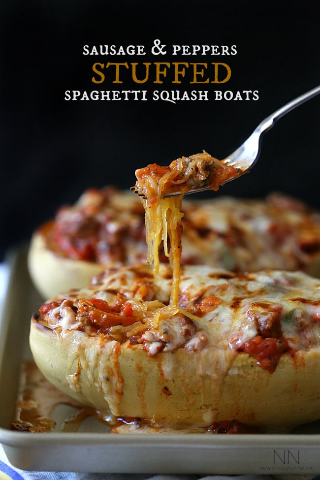 This sausage and peppers stuffed spaghetti squash is the perfect way to use up all that winter squash. Deliciously filling and and super simple to make. Sausage and Peppers Stuffed Spaghetti Squash being scooped out.