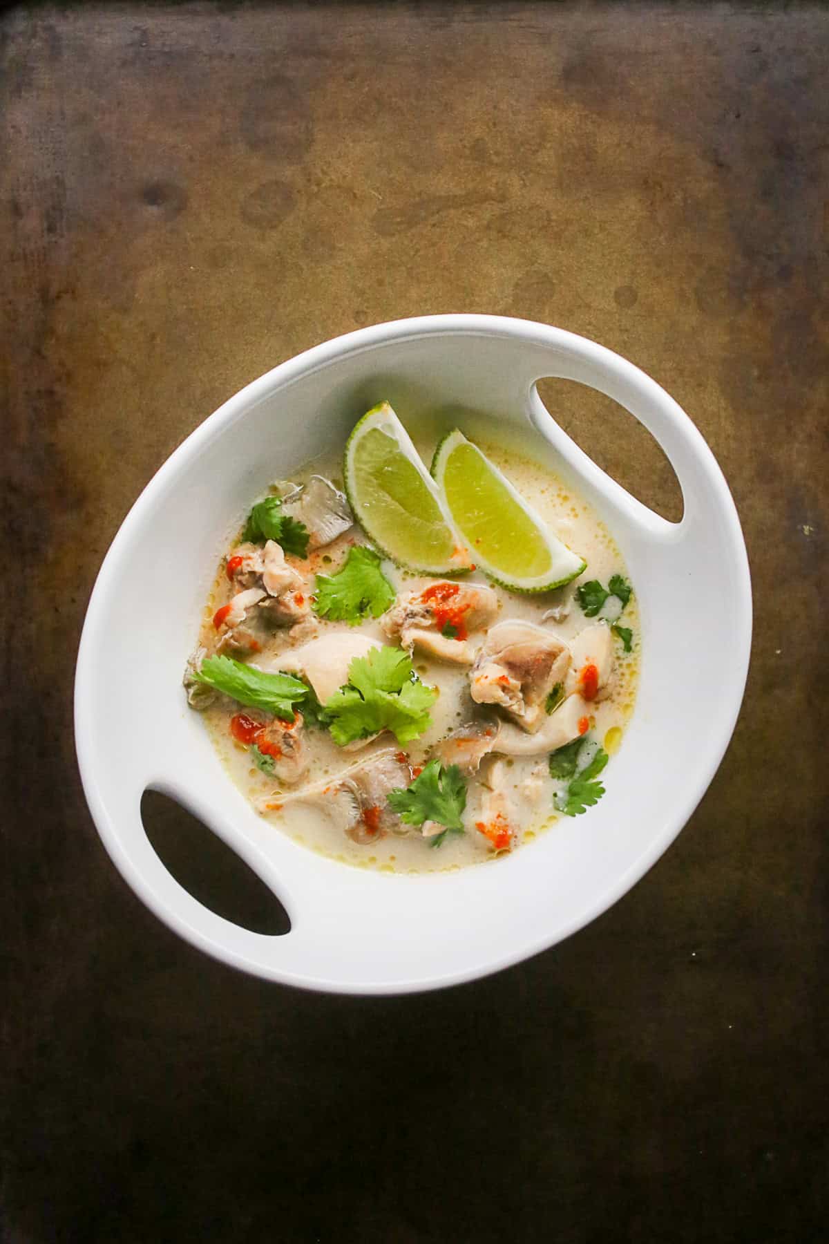 Tom Kha Gai drizzled with sriracha. 