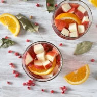 This simple Thanksgiving sangria is packed full of pomegranate seeds, apple, orange and semi sweet red wine. This drink is perfect for your holiday table.