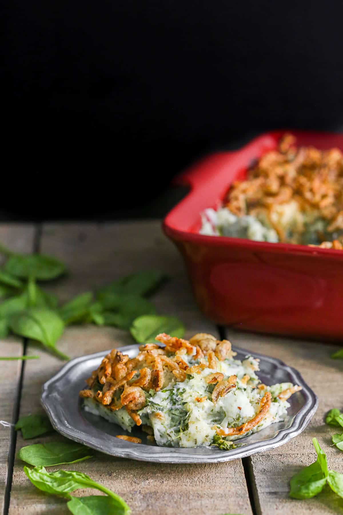 Spinach Parmesan Baked Mashed Potatoes scooped on a plate. 