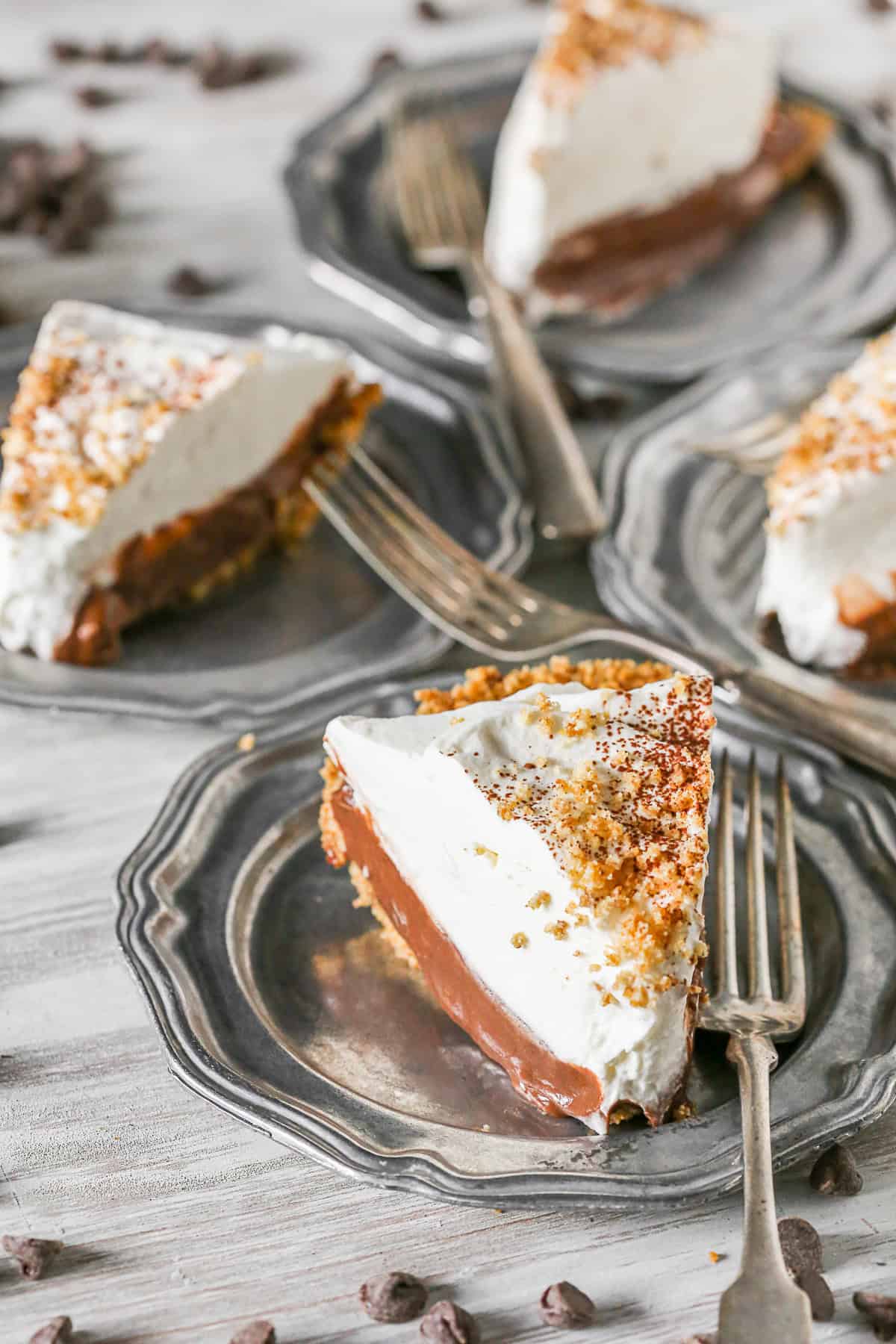 Chocolate Orange Pudding Pie served on a plate with a fork. 