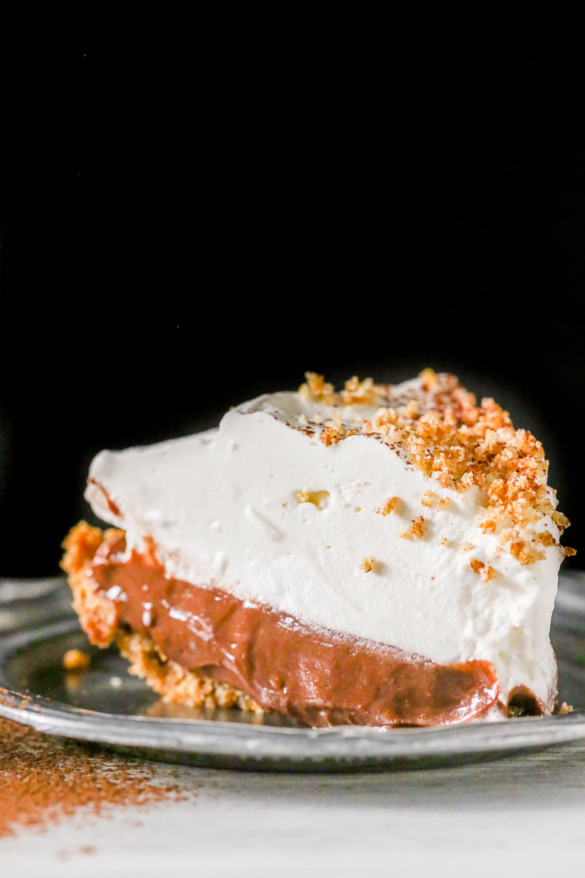 Chocolate Orange Pudding Pie sliced on a small plate. 