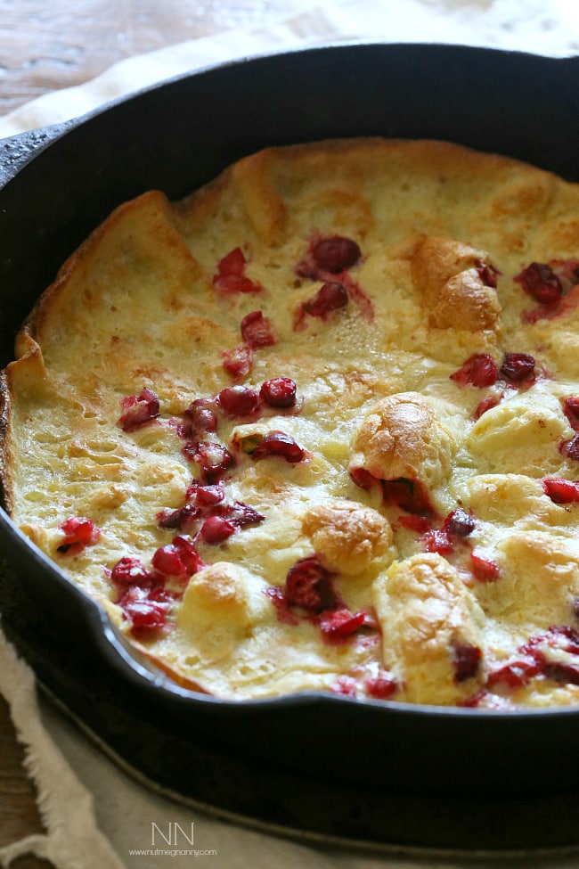 This cranberry orange Dutch baby is the highlight of your holiday season eating. Full of tart fresh cranberries and zesty orange flavor. Say hello to delicious! This cranberry orange Dutch baby is the highlight of your holiday season eating. Full of tart fresh cranberries and zesty orange flavor. Say hello to delicious!