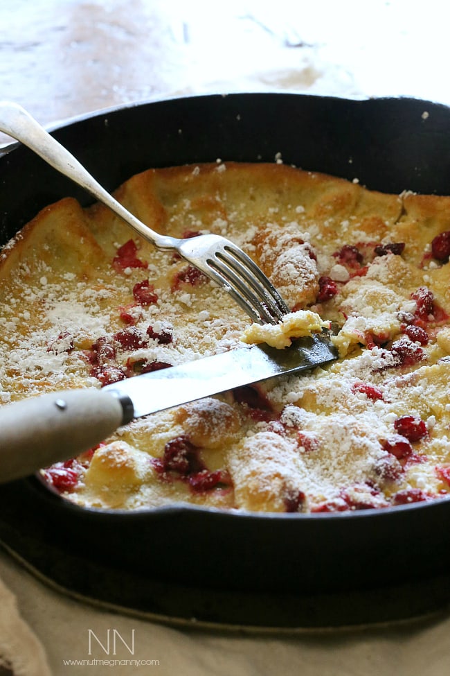 This cranberry orange Dutch baby is the highlight of your holiday season eating. Full of tart fresh cranberries and zesty orange flavor. Say hello to delicious! This cranberry orange Dutch baby is the highlight of your holiday season eating. Full of tart fresh cranberries and zesty orange flavor. Say hello to delicious!
