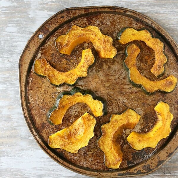This simple curry roasted acorn squash is the perfect easy Thanksgiving side dish. Packed full of flavor and ready in under 30 minutes!