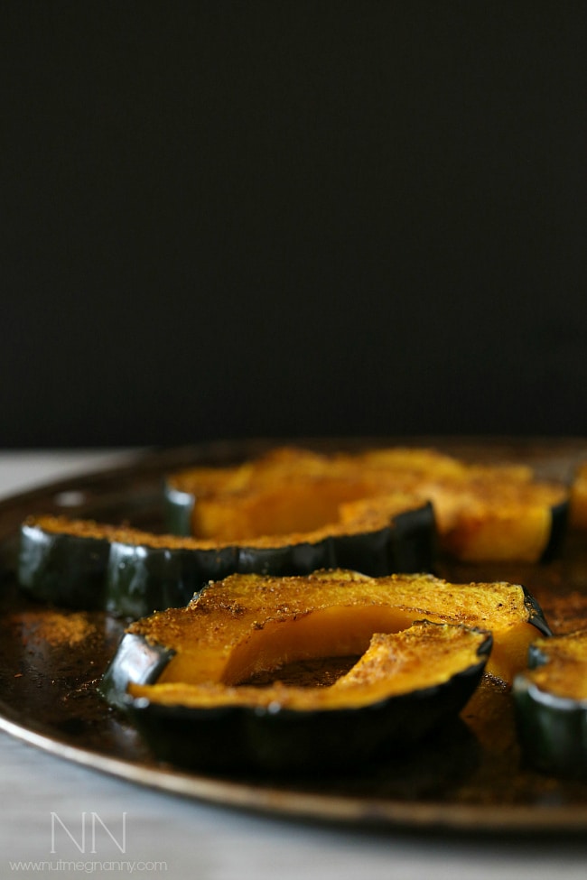 This simple curry roasted acorn squash is the perfect easy Thanksgiving side dish. Packed full of flavor and ready in under 30 minutes!