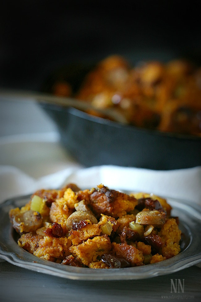 Pumpkin Cornbread Stuffing spooned onto a plate. 