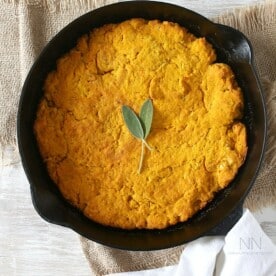 This simple homemade pumpkin sage cornbread can be eaten alone or turned into croutons and then into stuffing. Moist cornbread with a buttery crust - what's not to love?