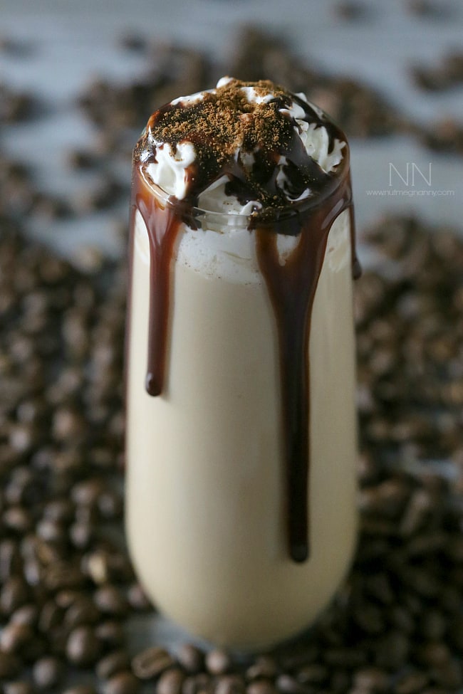 Pumpkin Spice White Russian in a glass with chocolate drizzle. 